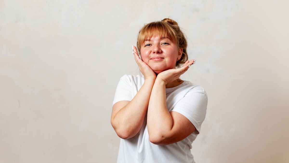 a person with the hands on the face